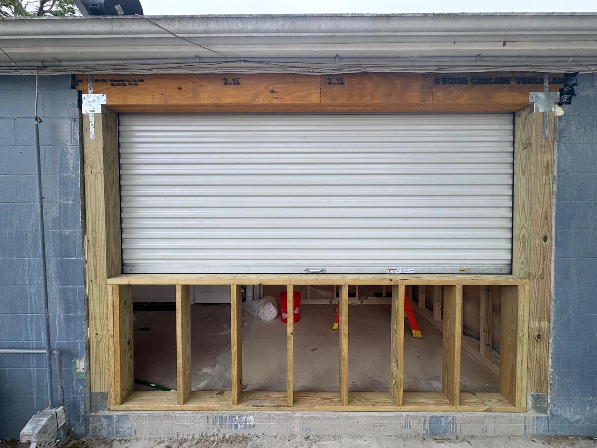 Bluefin commercial roll-up door installation with framing
